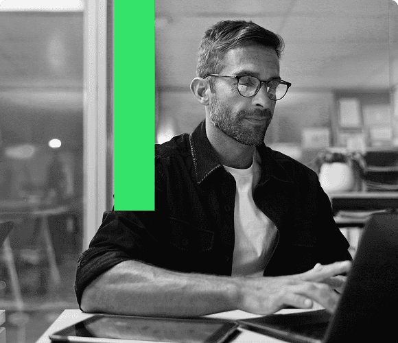 Man sat at desk on laptop responding to qualified form-fill enquiries